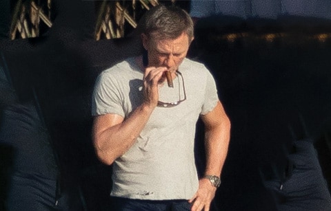 Daniel Caig Smoking A Cigar
